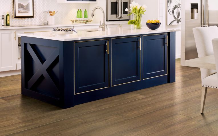 hardwood flooring in a kitchen with a large island